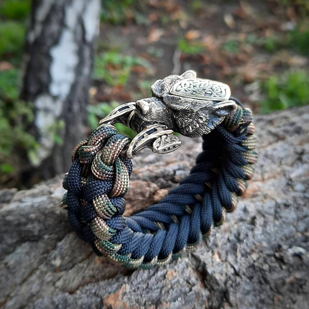 Thin Viking paracord bracelet with a carbine.